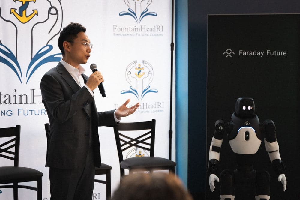 A FountainHead RI speaker addressing the audience on stage.