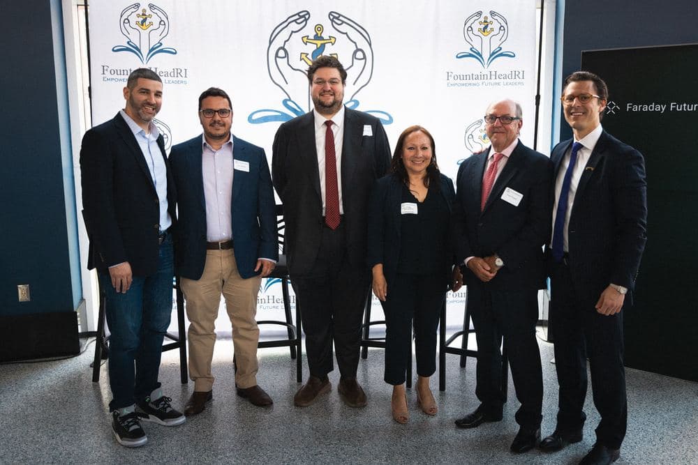A group of attendees posing together at a FountainHead RI event.