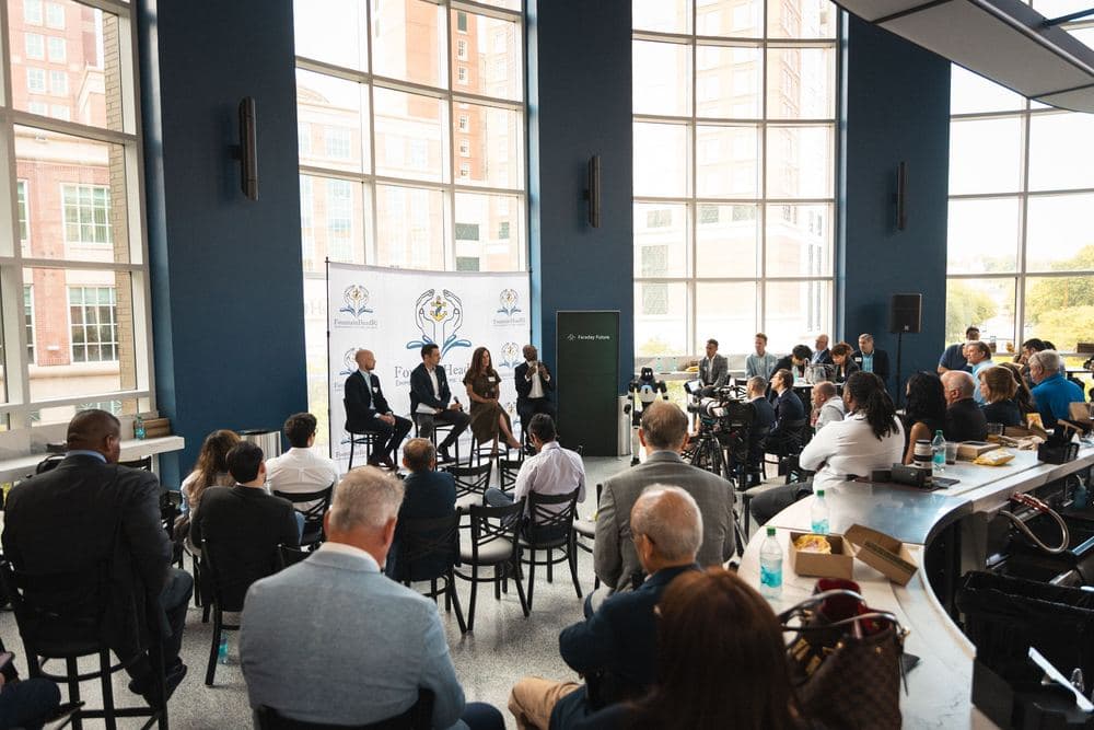 A wide view of attendees seated for a panel discussion at a FountainHead RI event.