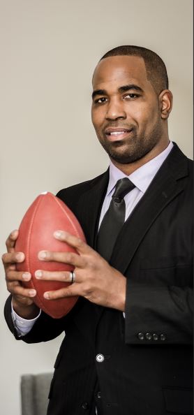 marques ogden promo shot holding football