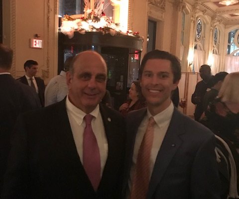 two men posing at networking event