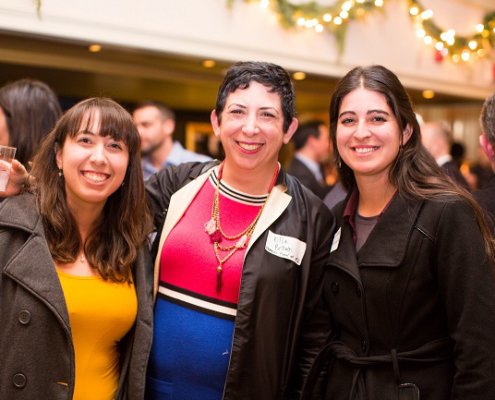 3 women posing for picture at networking event