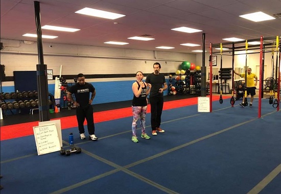 woman speaking at a crossfit workout class