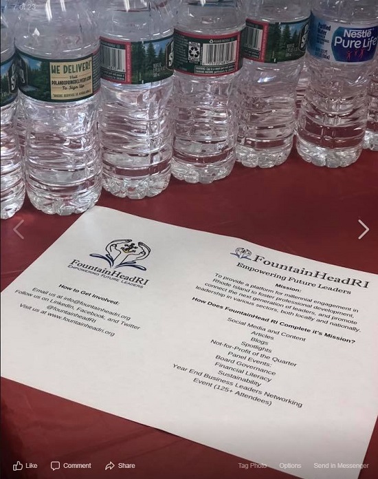 fountainhead printed flyer on table by bottles of water