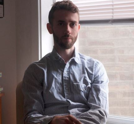 man sitting by window